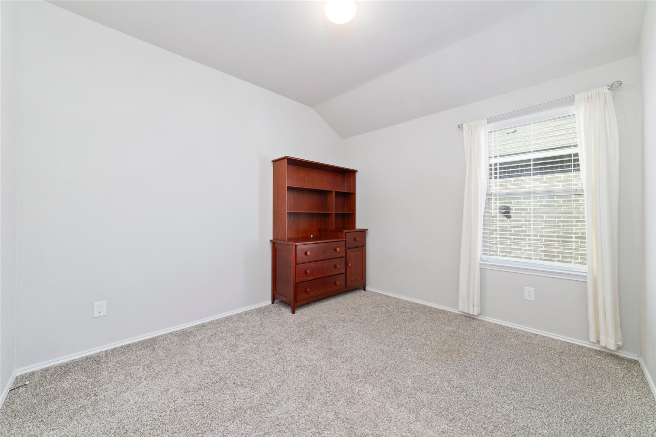 24323 Winchelsea Lane Spring, TX 77389 - Photo 20 of 24 an empty room with windows and cabinet