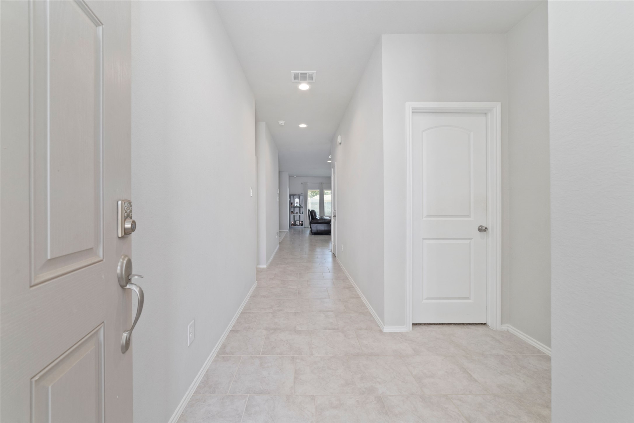 24323 Winchelsea Lane Spring, TX 77389 - Photo 4 of 24 a view of a hallway with wooden shelves
