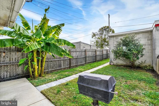 a front view of a house with a yard and porch