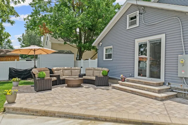 a view of house with outdoor space and parking