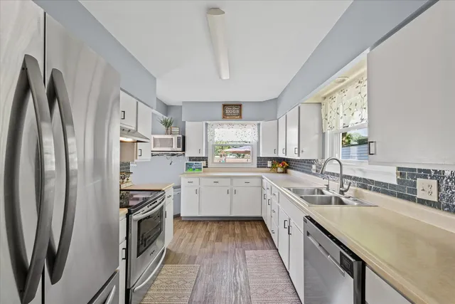 a kitchen with a sink and a window