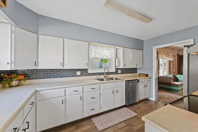 a bedroom with a bed and a baby crib