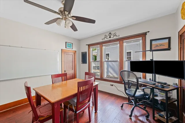 an aerial view of a residential houses with yard