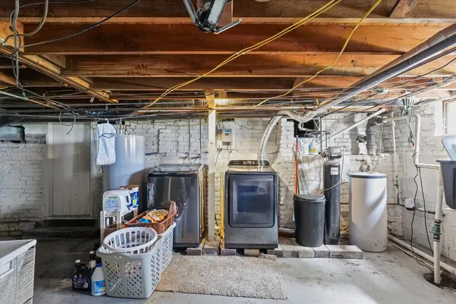 a view of house with a backyard