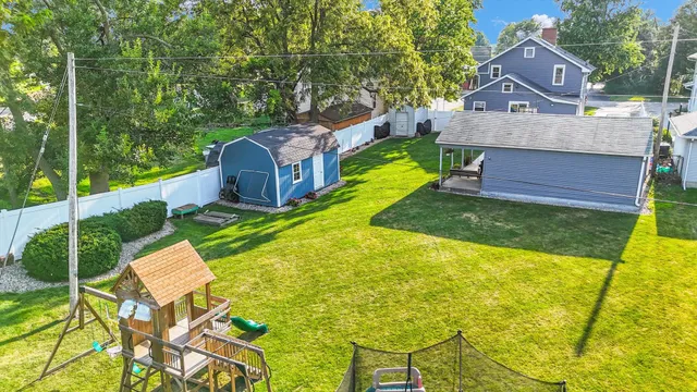 a room with a door open to a living room