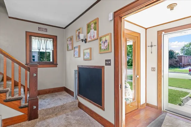 a room with a door open to a living room