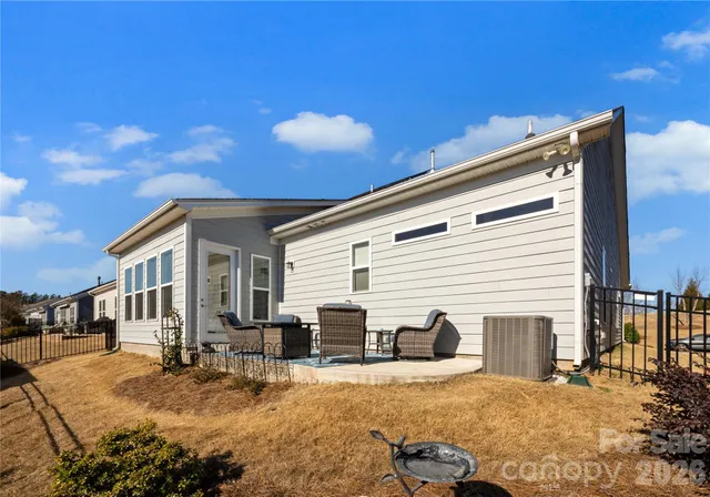 a view of a house with snow on the road