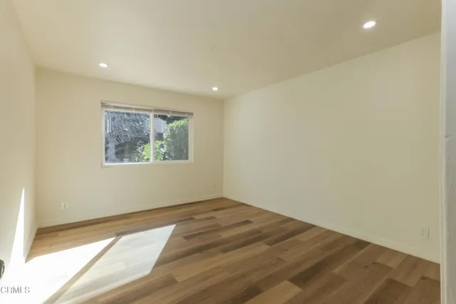 a view of a chair and table in the garden