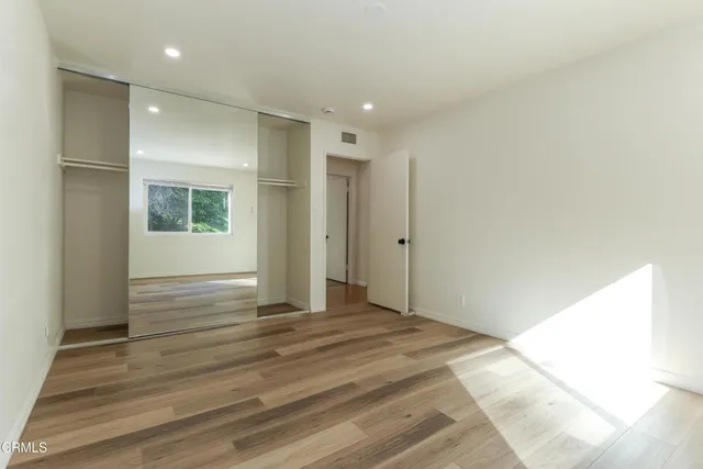 a view of a park with large trees