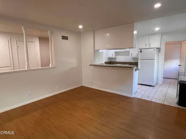a view of kitchen with wooden floor