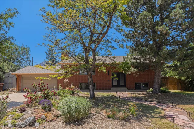 a view of a house with a tree