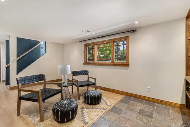 a bedroom with furniture and a window