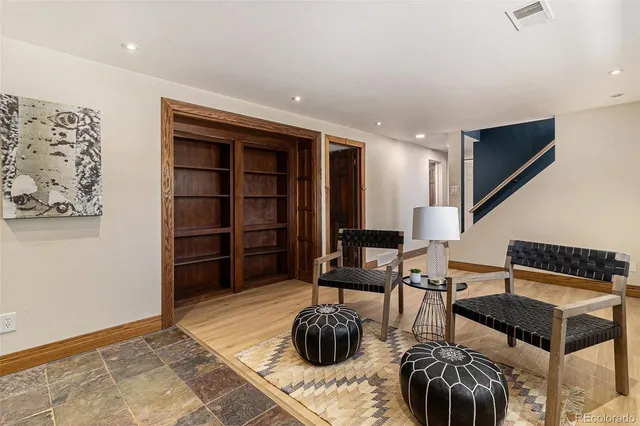 a bedroom with furniture and a rug