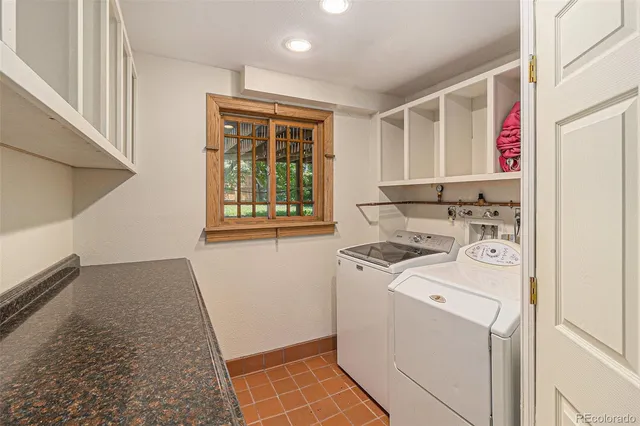 a view of storage and utility room with washer and dryer