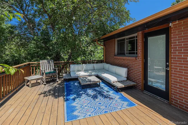 a roof deck view with a seating space