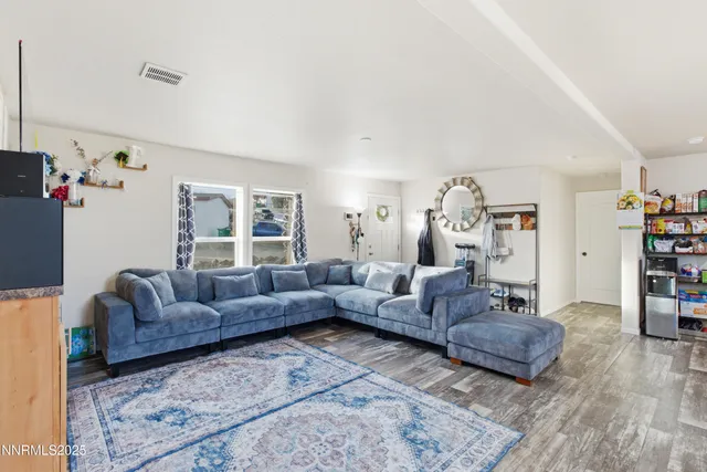 a living room with furniture and a couch