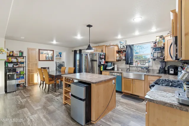 a kitchen that has a lot of cabinets in it