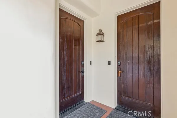 a bedroom with a bed and a television