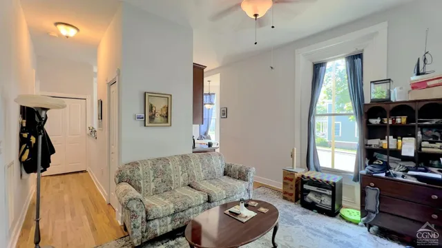 a living room with furniture and a window