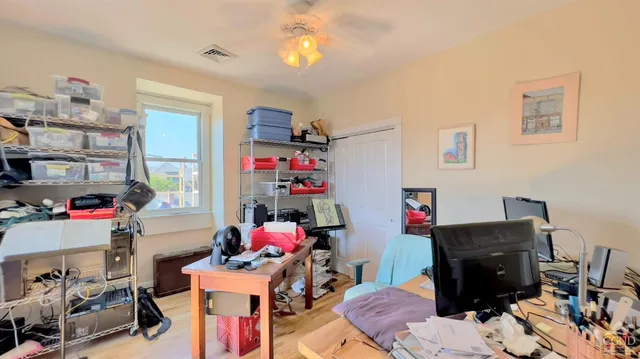 a room with furniture and a wooden floor