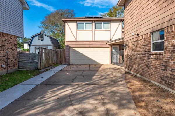 a house view with a garden space