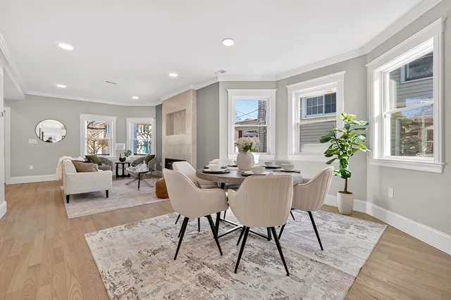 a view of a dining room with furniture window and wooden floor