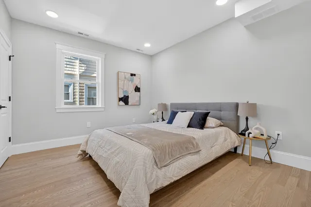 a bedroom with a bed and window