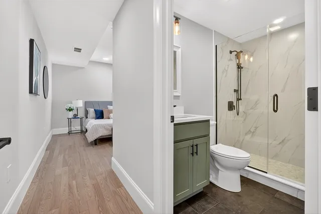 a en suite bathroom with a toilet sink and shower