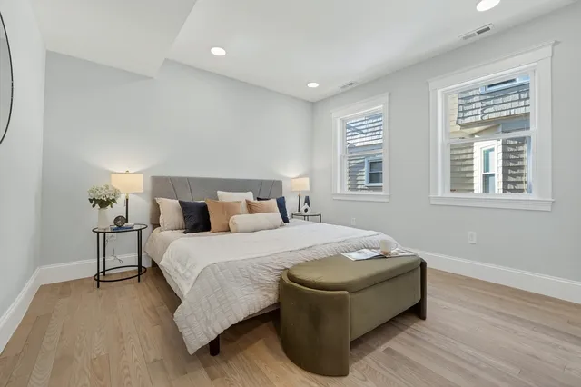 a bedroom with bed and a window