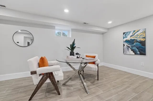 a workspace with furniture and wooden floor