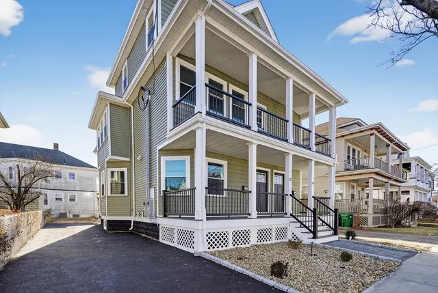 front view of a building with a yard