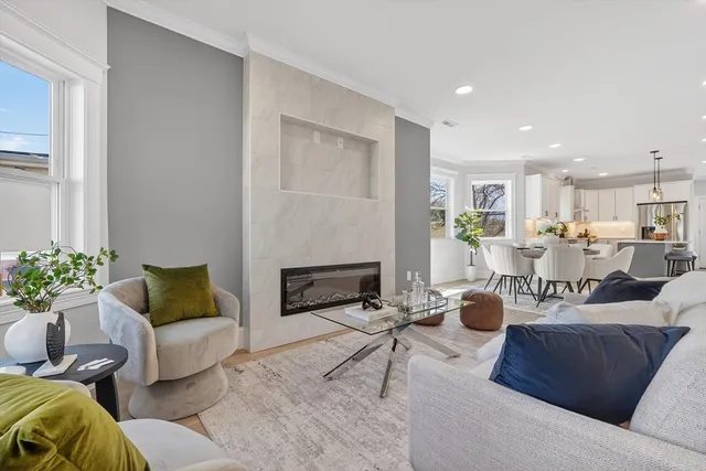 a living room with furniture and a fireplace