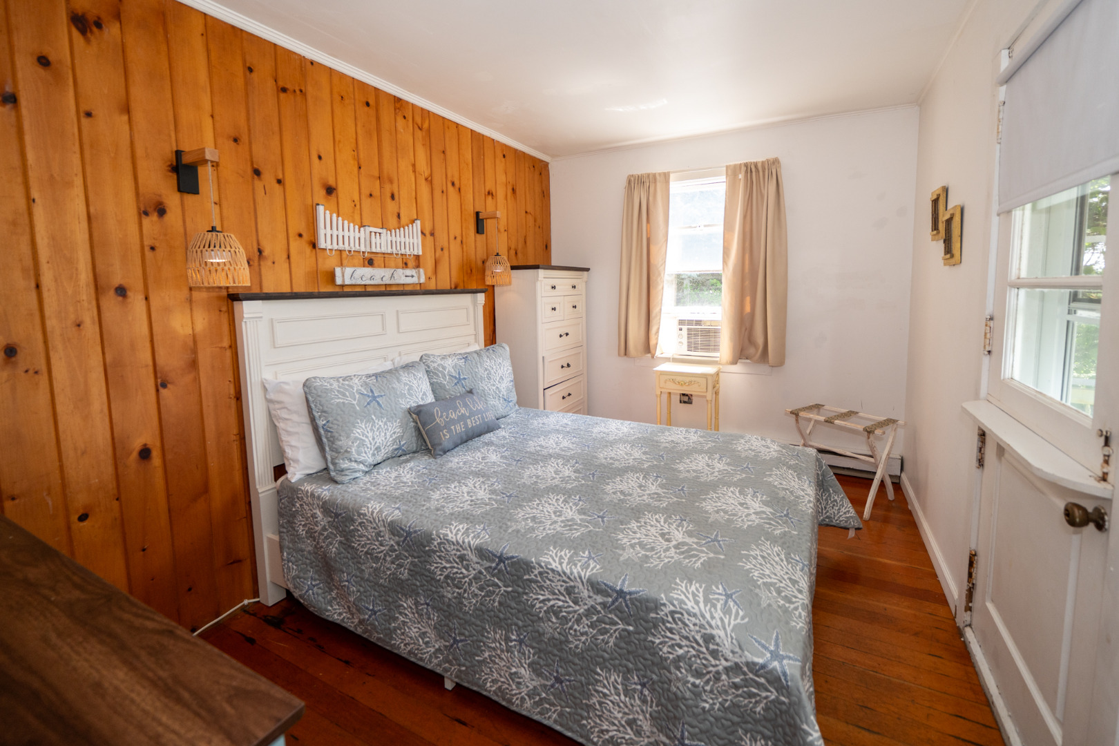 11 Beach Road Oak Bluffs, MA 02557 - Photo 12 of 18 a bed room with a bed and a window
