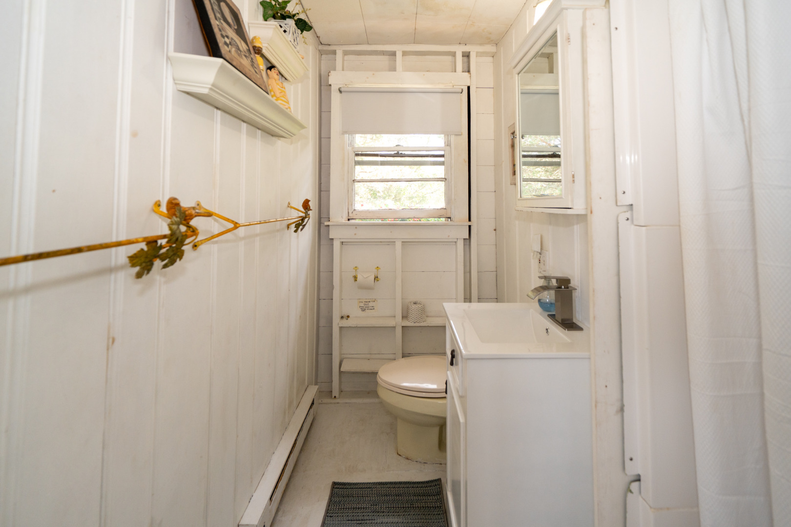 11 Beach Road Oak Bluffs, MA 02557 - Photo 10 of 18 a bathroom with a granite countertop sink a toilet and shower