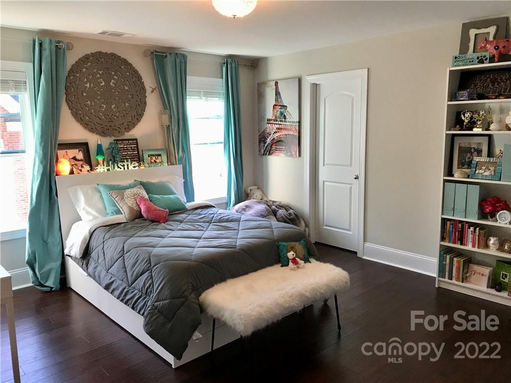 907 Ospre Lane Fort Mill, SC 29708 - Photo 28 of 39 a bedroom with a bed and a book shelf