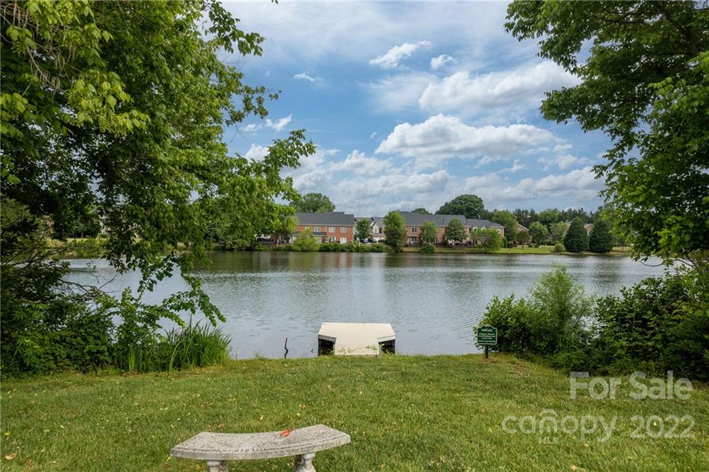 907 Ospre Lane Fort Mill, SC 29708 - Photo 38 of 39 a view of a lake with a big yard and large trees