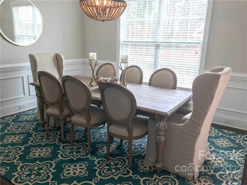 907 Ospre Lane Fort Mill, SC 29708 - Photo 8 of 39 a view of a dining room with furniture and wooden floor