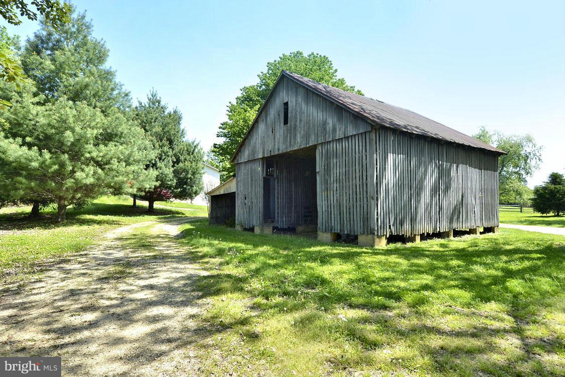 5507 Brooks Woods Road Lothian, MD 20711 - Photo 3 of 30 Two Verdant Acres with Quaint Corn Crib