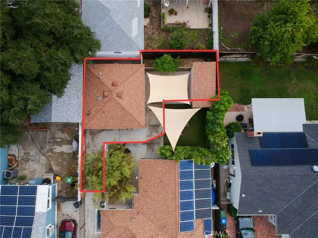 an aerial view of house with pool outdoor seating and yard
