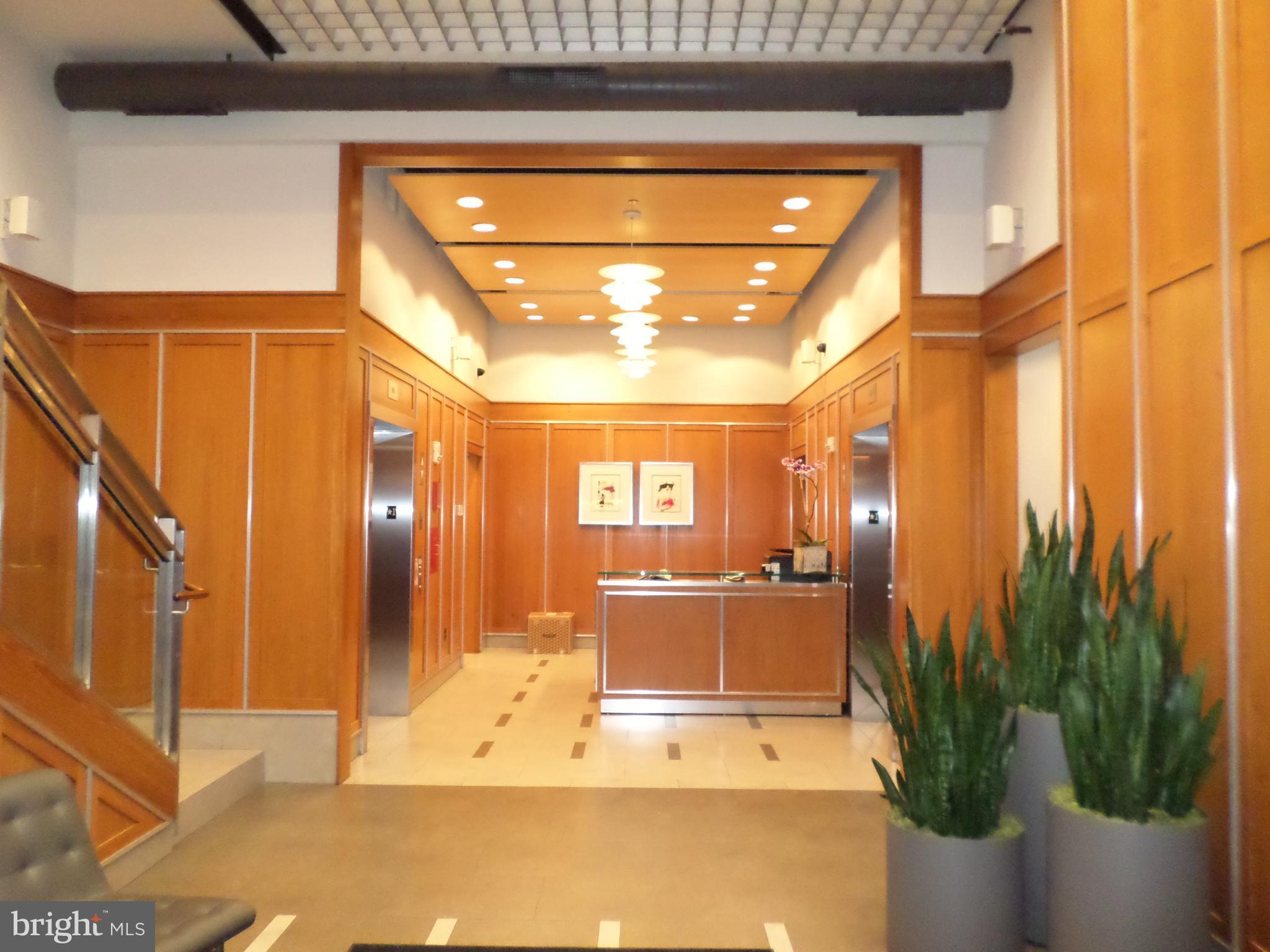 1133 14th Street Northwest, Unit 903 Washington, DC 20005 - Photo 2 of 18 Lobby with front desk