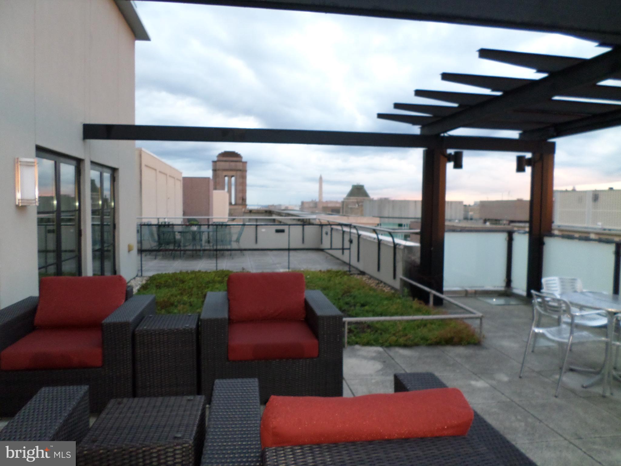 1133 14th Street Northwest, Unit 903 Washington, DC 20005 - Photo 14 of 18 Building roof-deck with sitting area