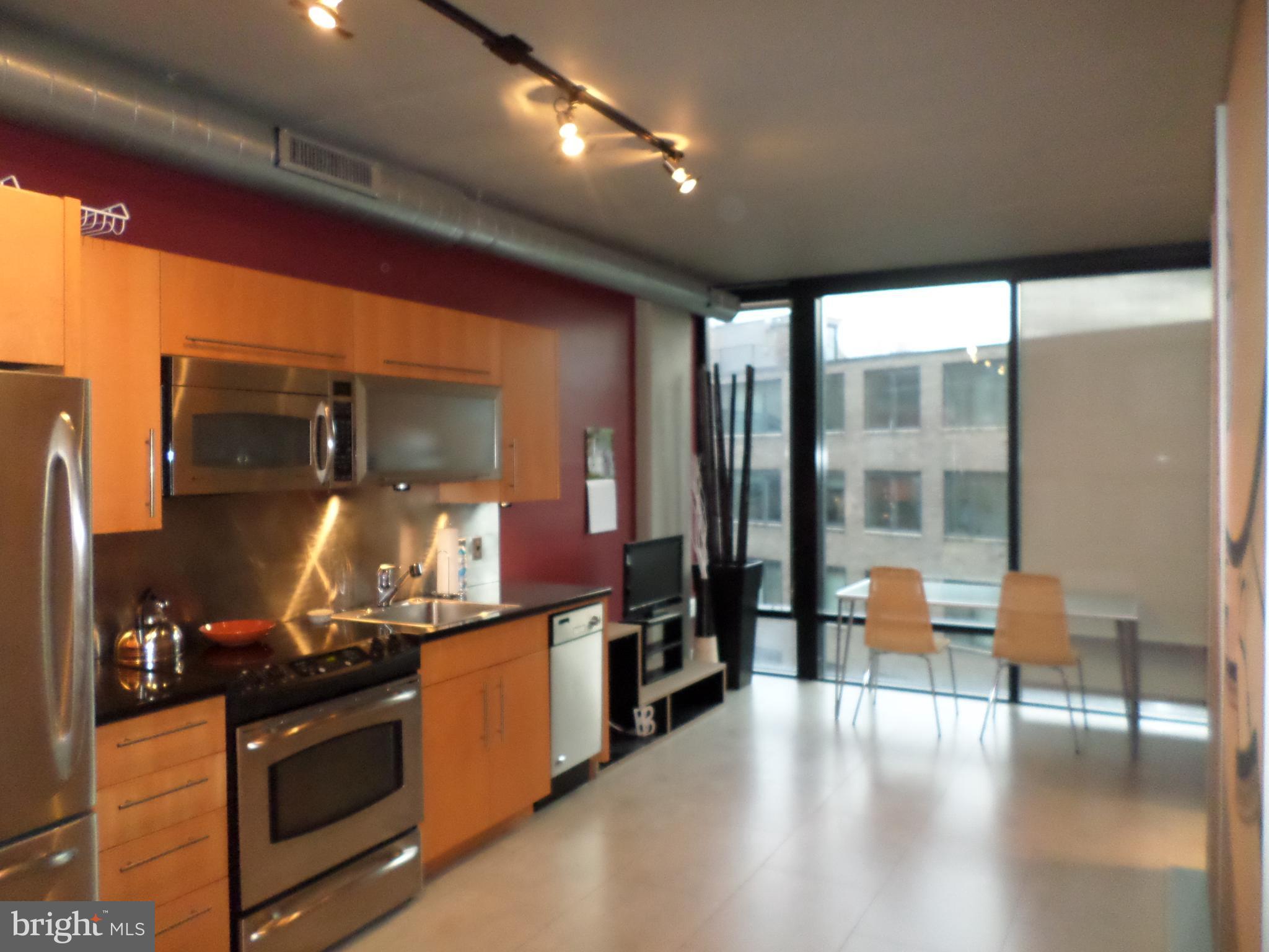 1133 14th Street Northwest, Unit 903 Washington, DC 20005 - Photo 3 of 18 Open Kitchen with eating and living area