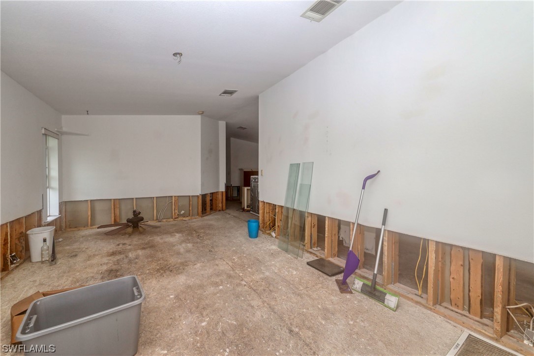 149 Raintree Lane Fort Myers, FL 33908 - Photo 13 of 22 a view of an empty room with stairs
