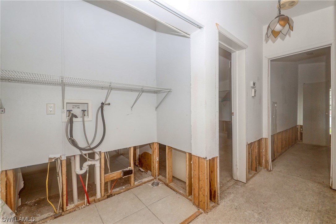 149 Raintree Lane Fort Myers, FL 33908 - Photo 15 of 22 a view of a room with lots of windows