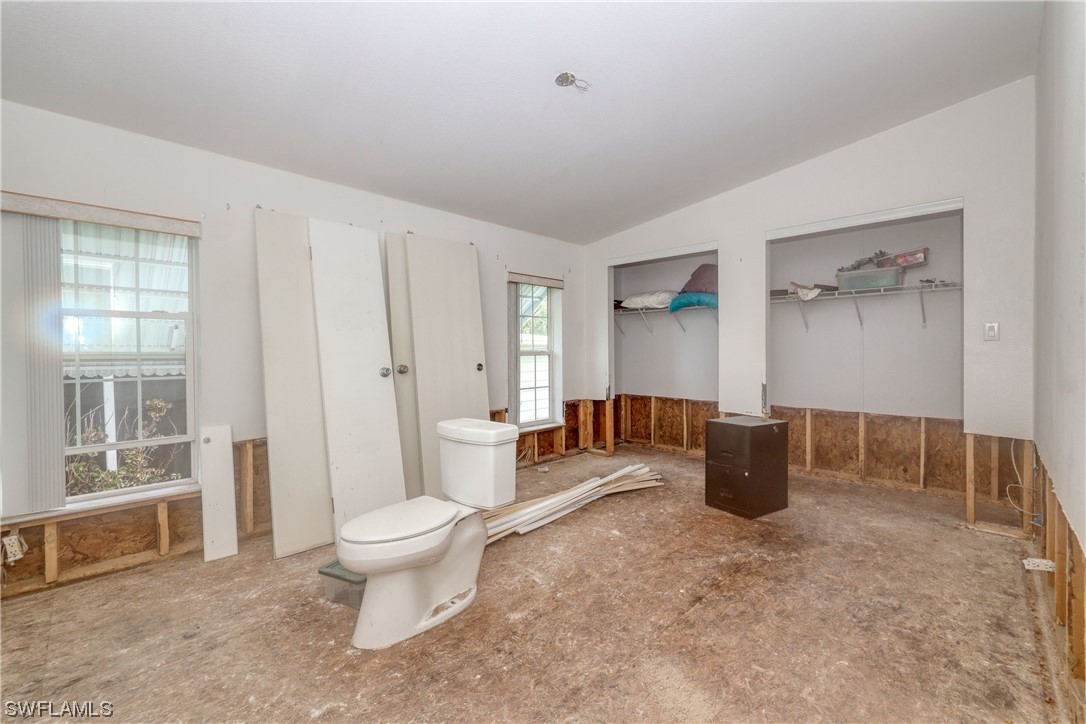 149 Raintree Lane Fort Myers, FL 33908 - Photo 16 of 22 a living room with furniture a window and a table