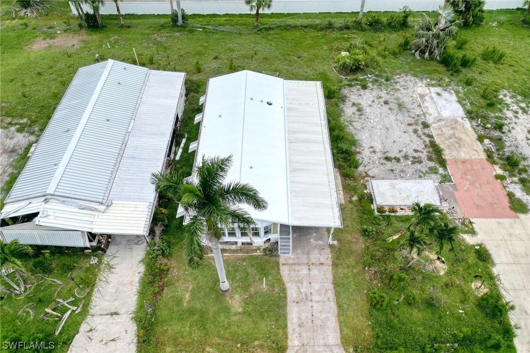 149 Raintree Lane Fort Myers, FL 33908 - Photo 5 of 22 an aerial view of a house with garden space and a yard