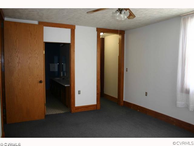 3620 Shepherd Spring Road Gum Spring, VA 23065 - Photo 7 of 8 a view of an empty room with wooden floor and closet