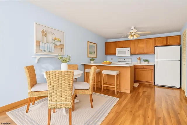 a living room with a couch and wooden floor