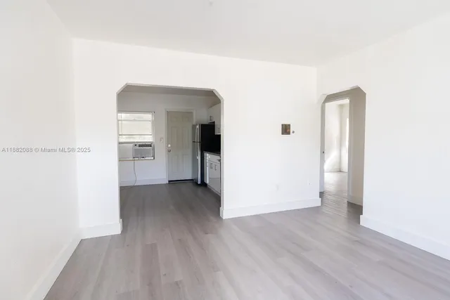 a view of a livingroom with wooden floor