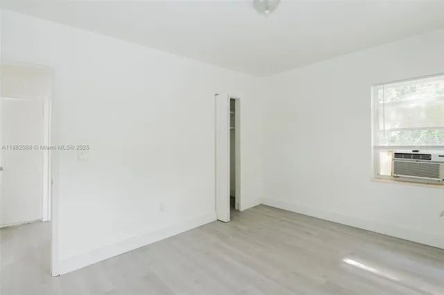 an empty room with a empty space and window